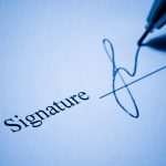 Signature on the line of contract